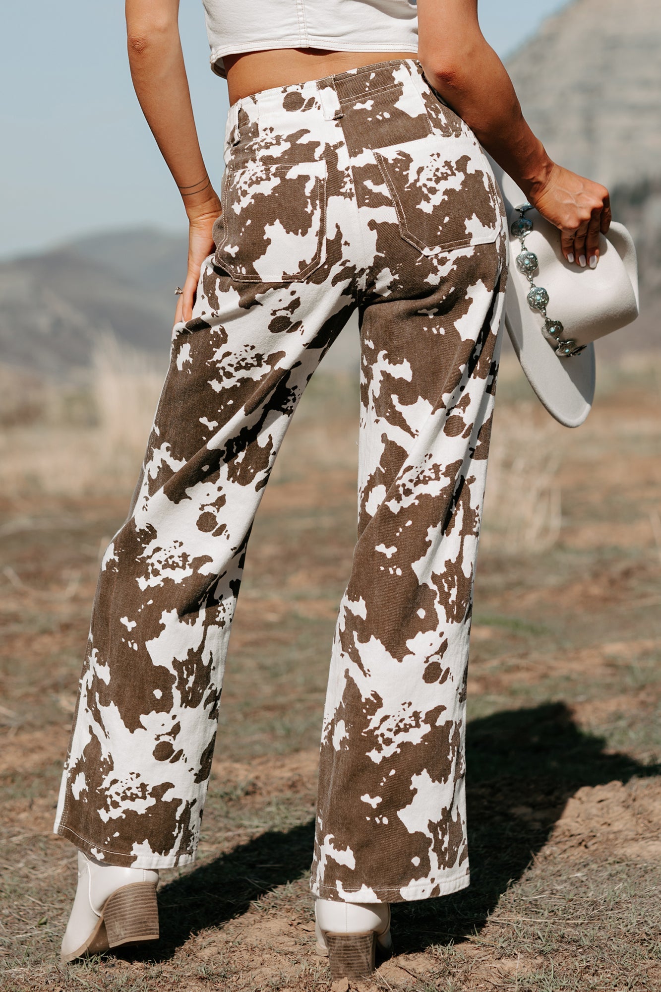 Cowboy Up Cow Print Pants (White/Brown)